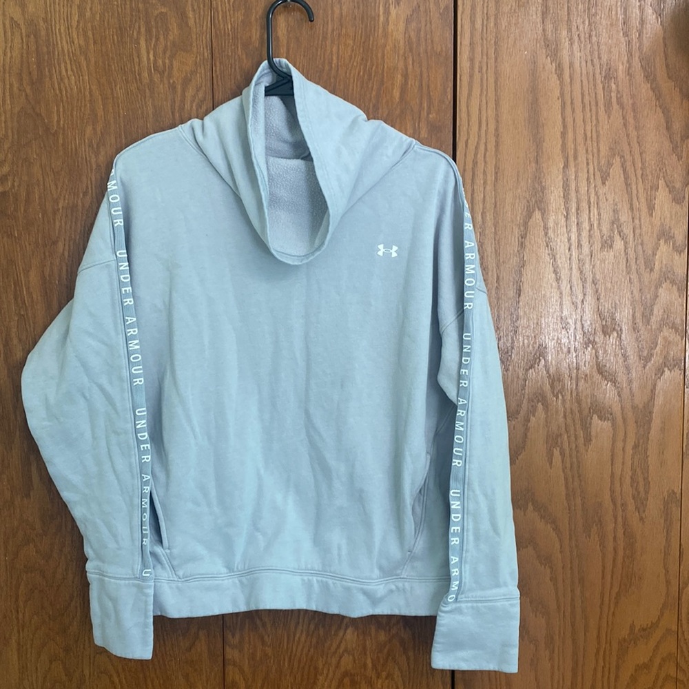 Woman’s light grey Under Armor sweatshirt